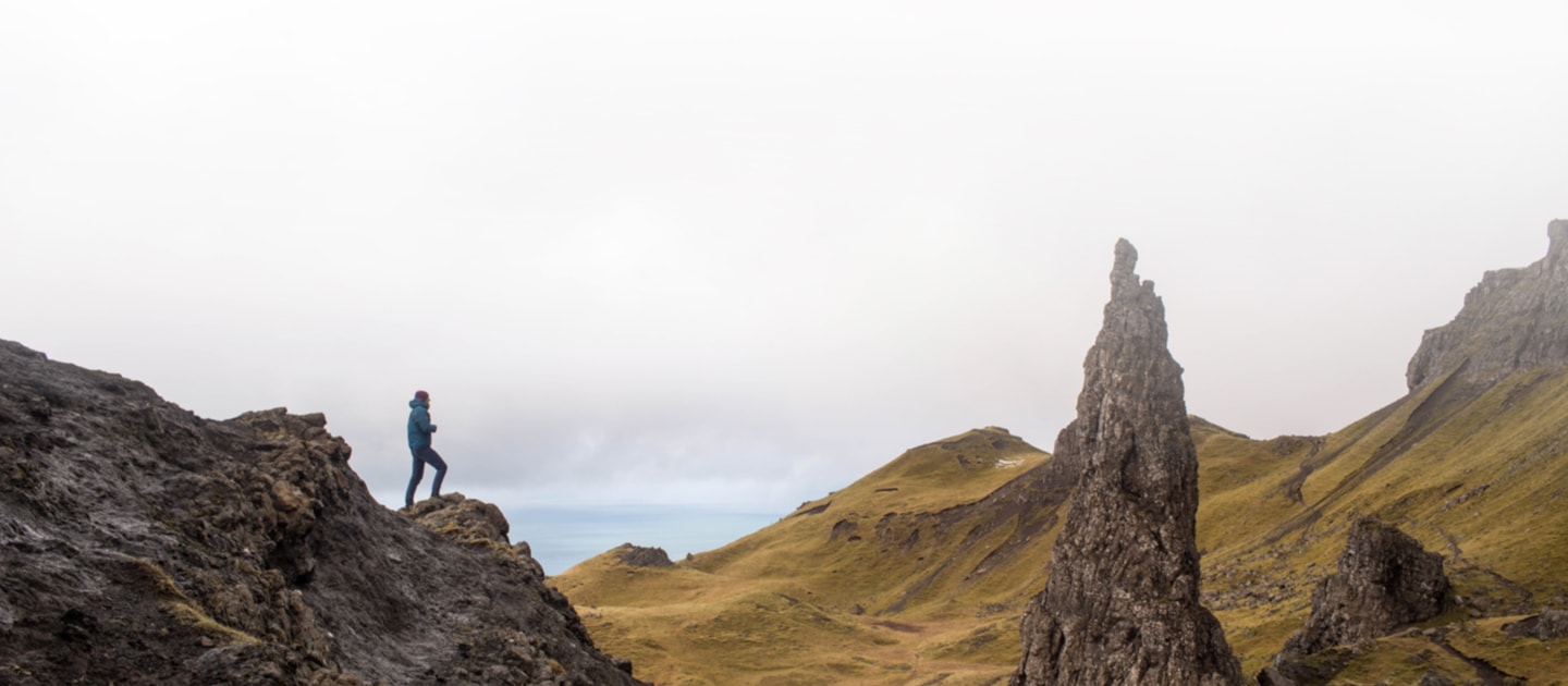 Hiker standing on cliffs