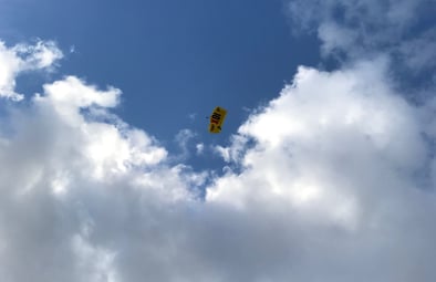 grant-parachuting-blue-sky